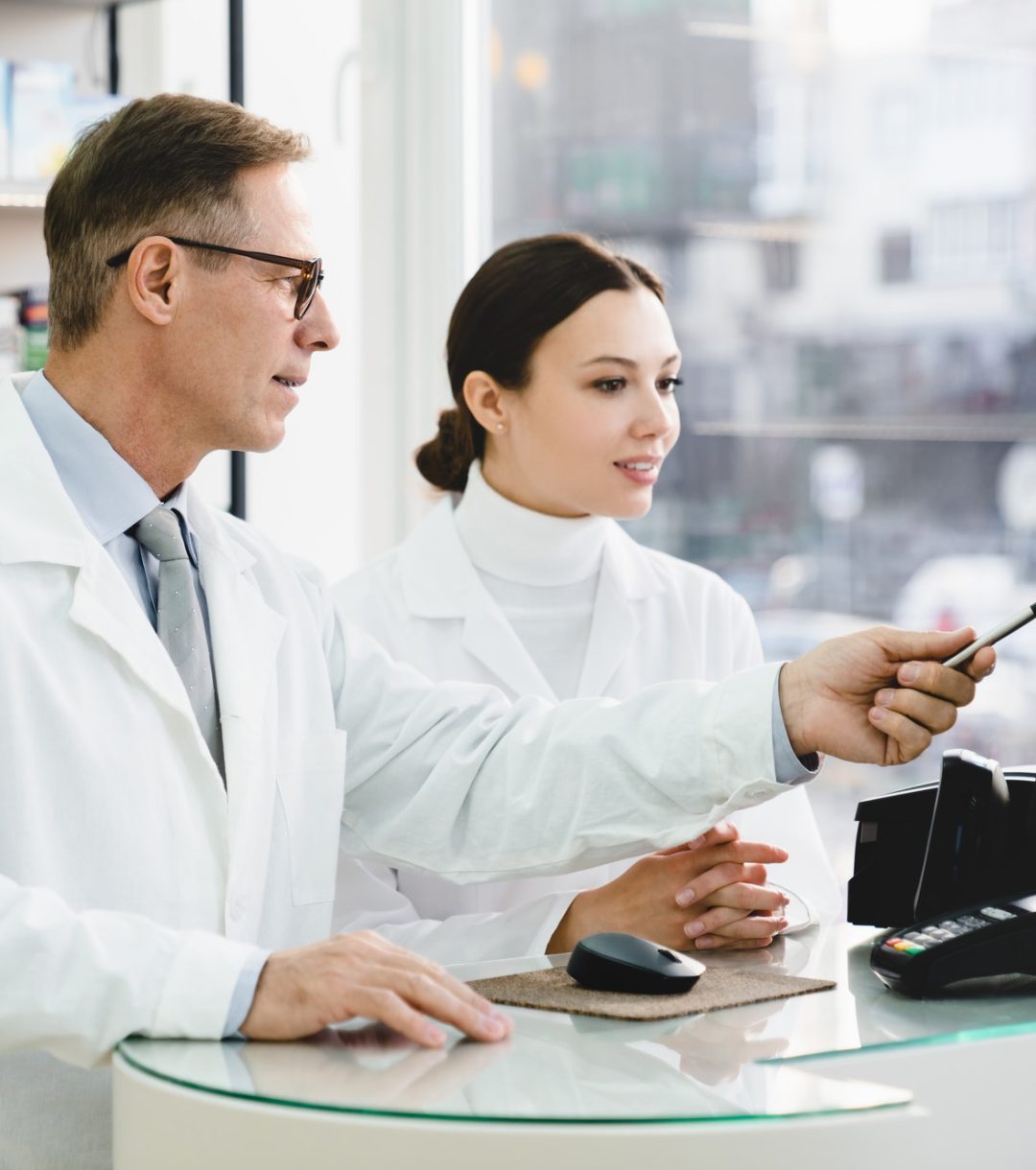 pharmacist-pointing-showing-male-colleague-medication-prices-prescriptions-on-computer-screen.jpg pharmacist-pointing-showing-male-colleague-medication-prices-prescriptions-on-computer-screen.jpg